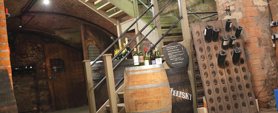 Averys cellar with barrels